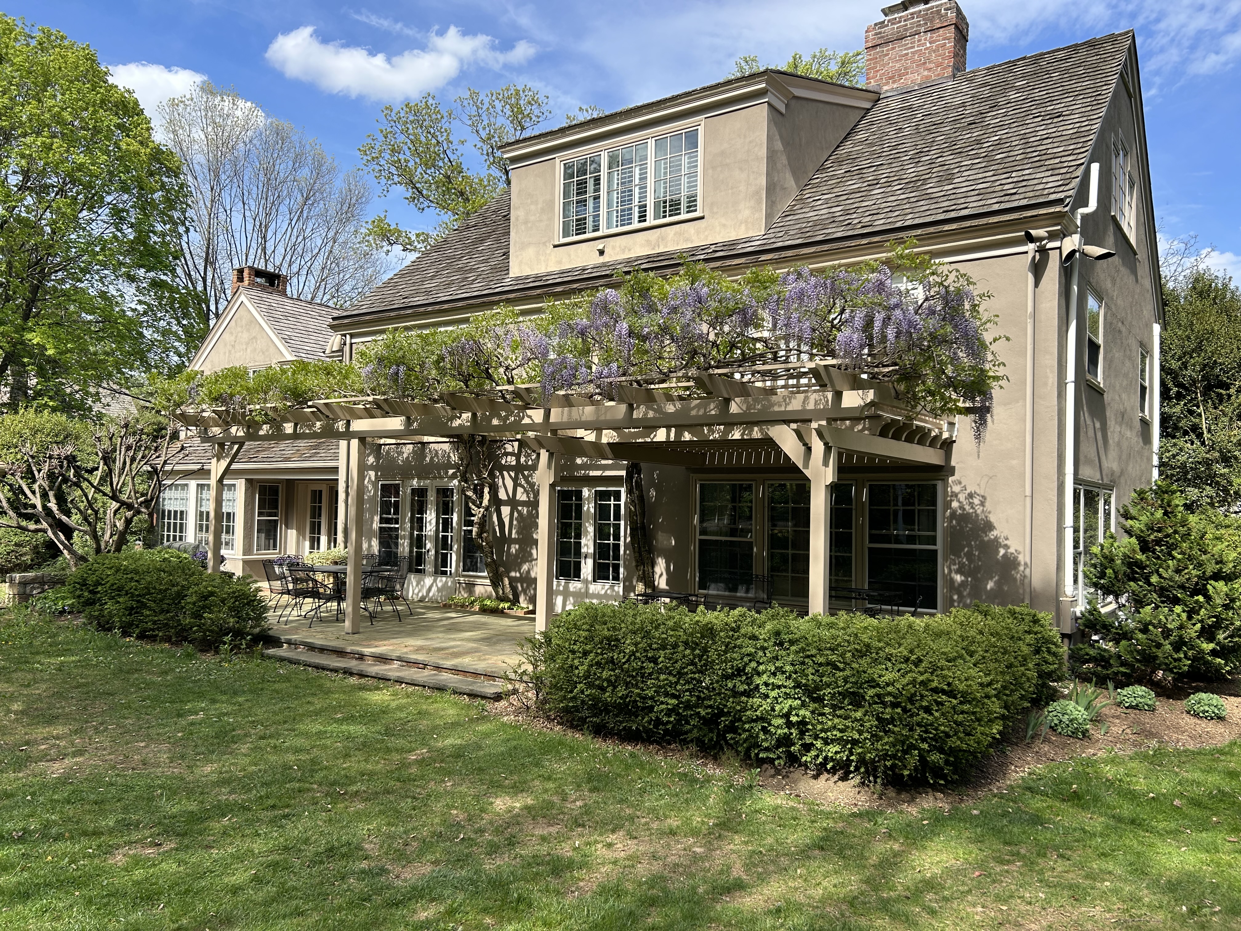 Pergola and deck built around two ancient wisteria trees