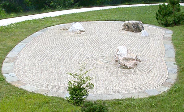 A traditional zen rock garden designed with attention to stone selection and placement.